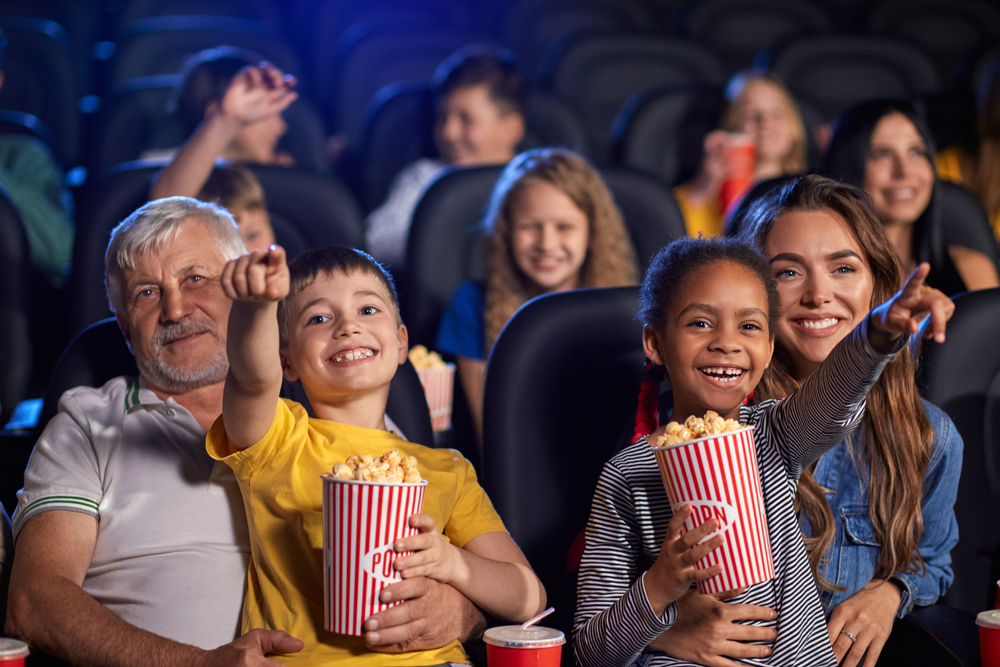 Family watching film in the cinema